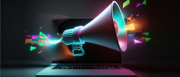 Digital megaphone projecting colorful geometric shapes from a laptop screen