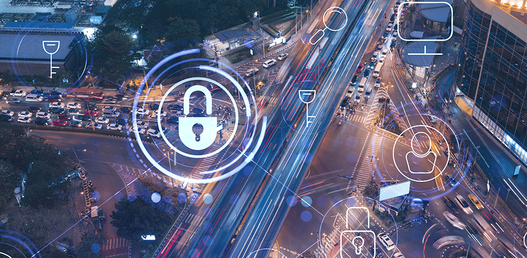 Aerial view of a busy city intersection with digital security icons overlayed, including a padlock