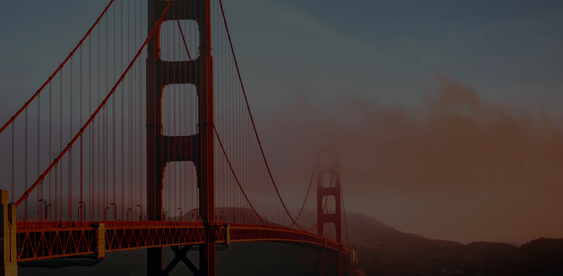 Golden Gate Bridge shrouded in fog at dusk, representing the San Francisco setting for the Marketplace Risk Conference.