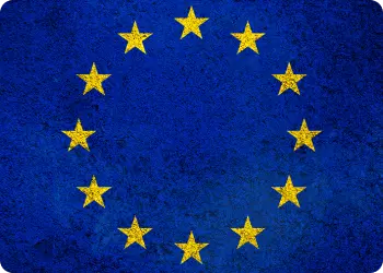 European Union flag with twelve golden stars arranged in a circle on a blue background.